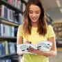woman in a yellow shirt holding brochures with VEVOR thermal binding covers in a library.