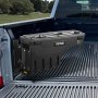 VEVOR truck bed storage box mounted on the side of a black truck bed with lush greenery in the background.