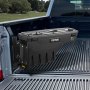 VEVOR truck bed storage box mounted in a pickup truck bed, with a forest in the background.