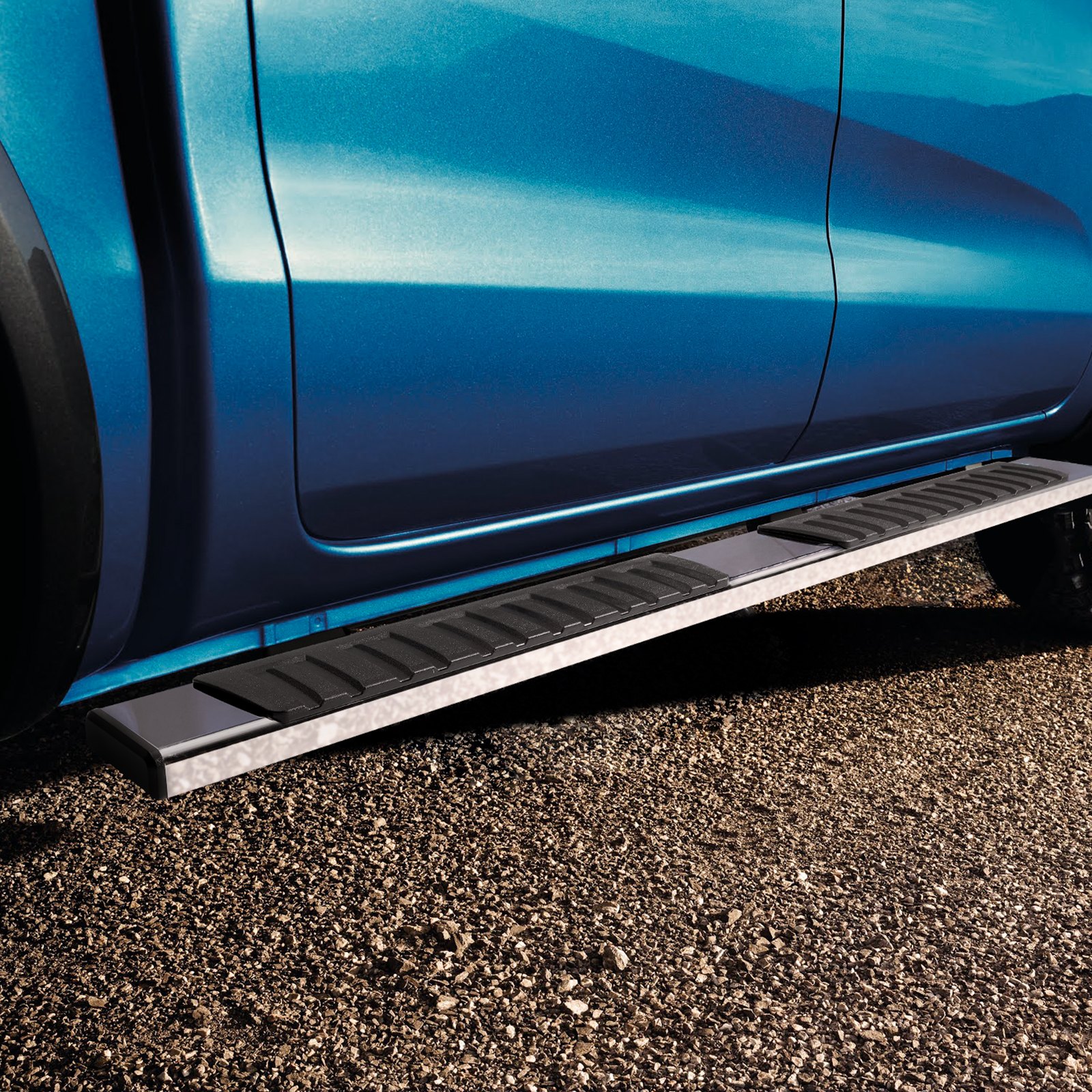 blue truck with textured VEVOR running boards on a gravel road for easy entry and exit.
