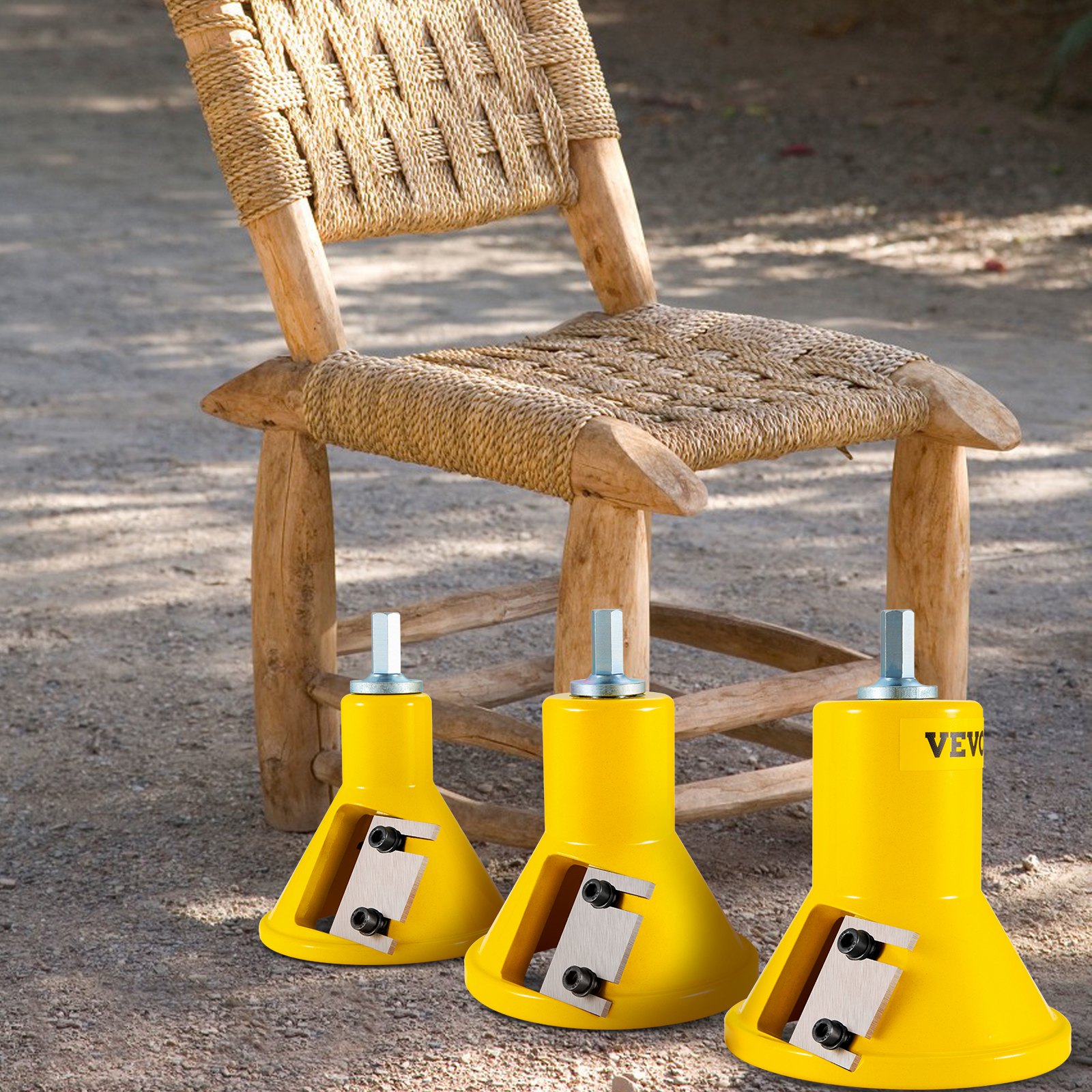 rustic wooden chair beside three yellow VEVOR tenon cutters on a sandy ground.