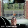 hand holding remote for VEVOR swing gate opener while sitting in a car.