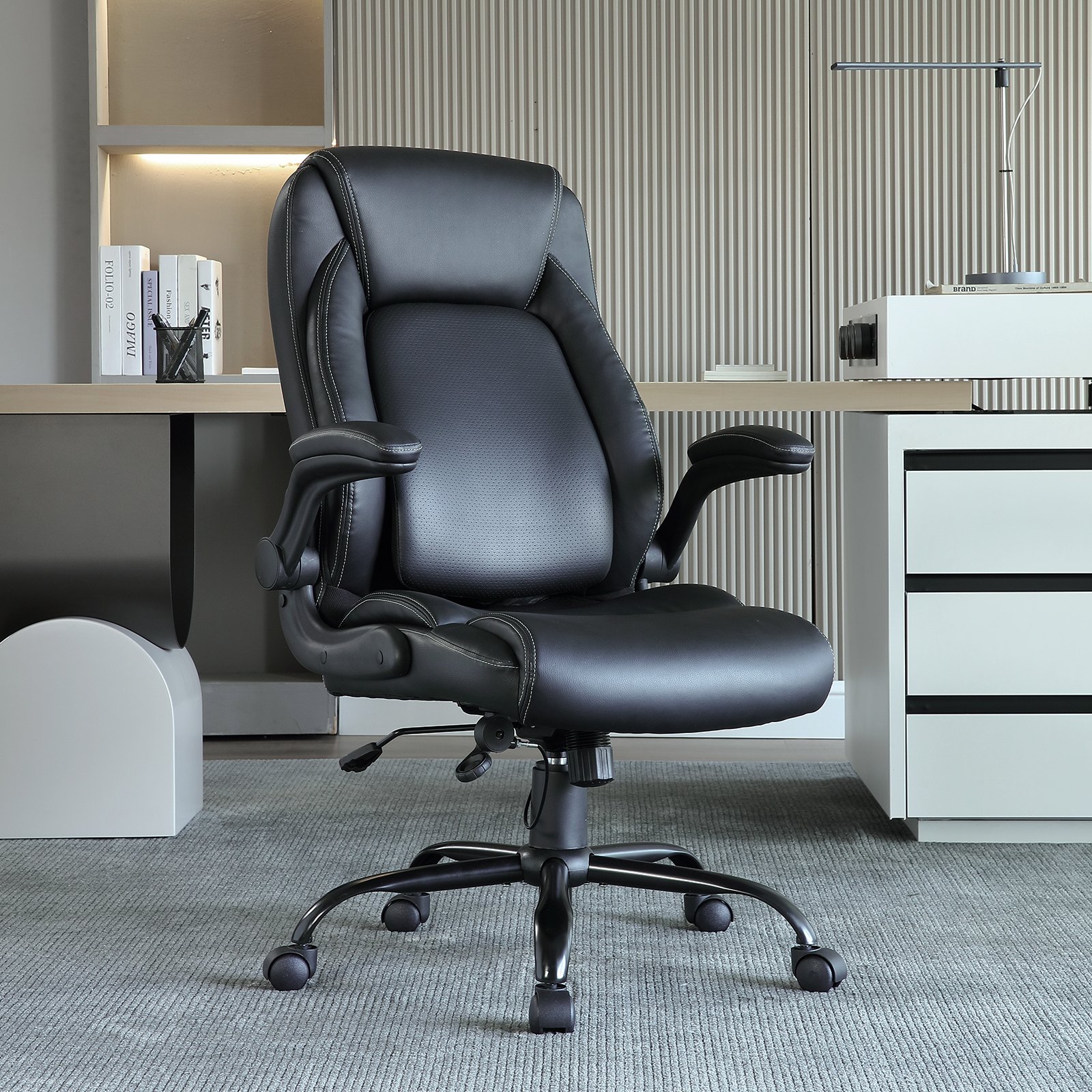 modern black VEVOR executive office chair in a sleek office environment with desk and shelves.