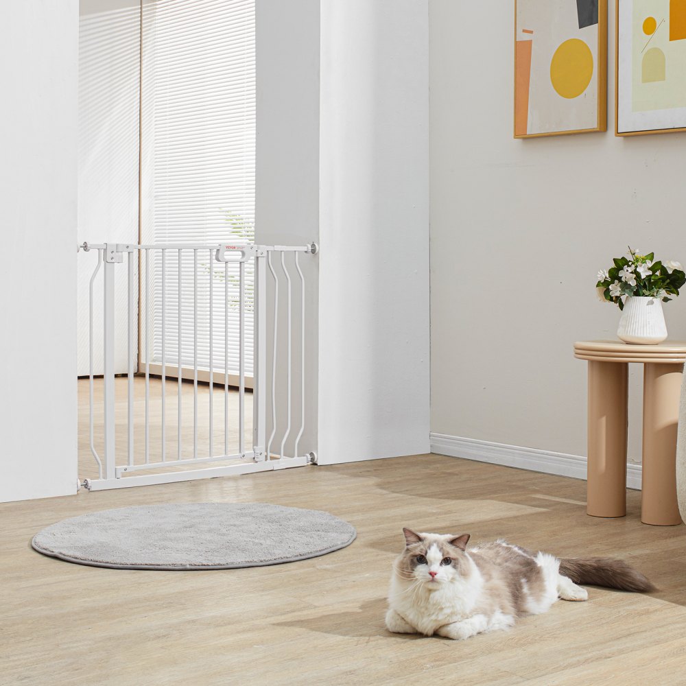 VEVOR baby gate in a modern living room with a cat lying on wooden floor next to a table and artwork.