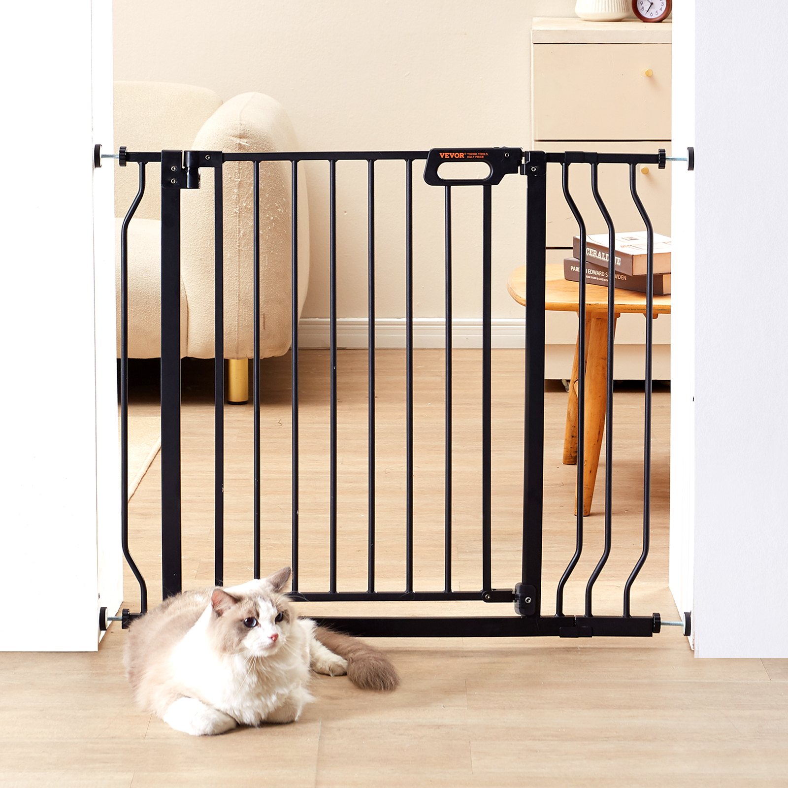 adult and child standing behind VEVOR baby gate with cat on floor in living room with white blinds.