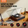 Reproductor de discos de vinilo VEVOR sobre mesa de madera con modelo de torre eiffel, compatible con 33/45/78 rpm.