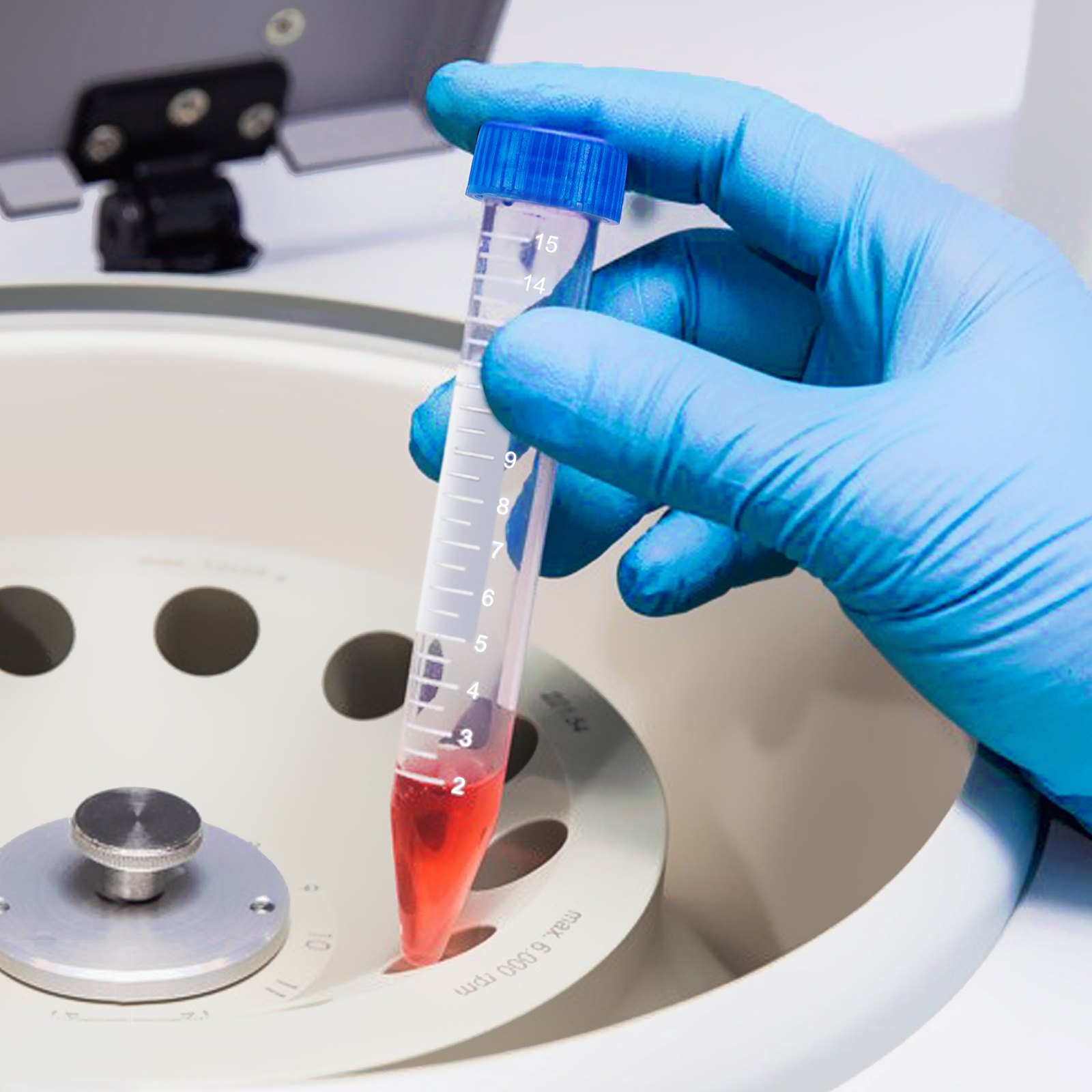 gloved hand holding VEVOR centrifuge tube with red liquid near centrifuge rotor.