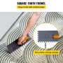 square-tooth trowel being used to spread adhesive with uniform lines; VEVOR shower curb kit.