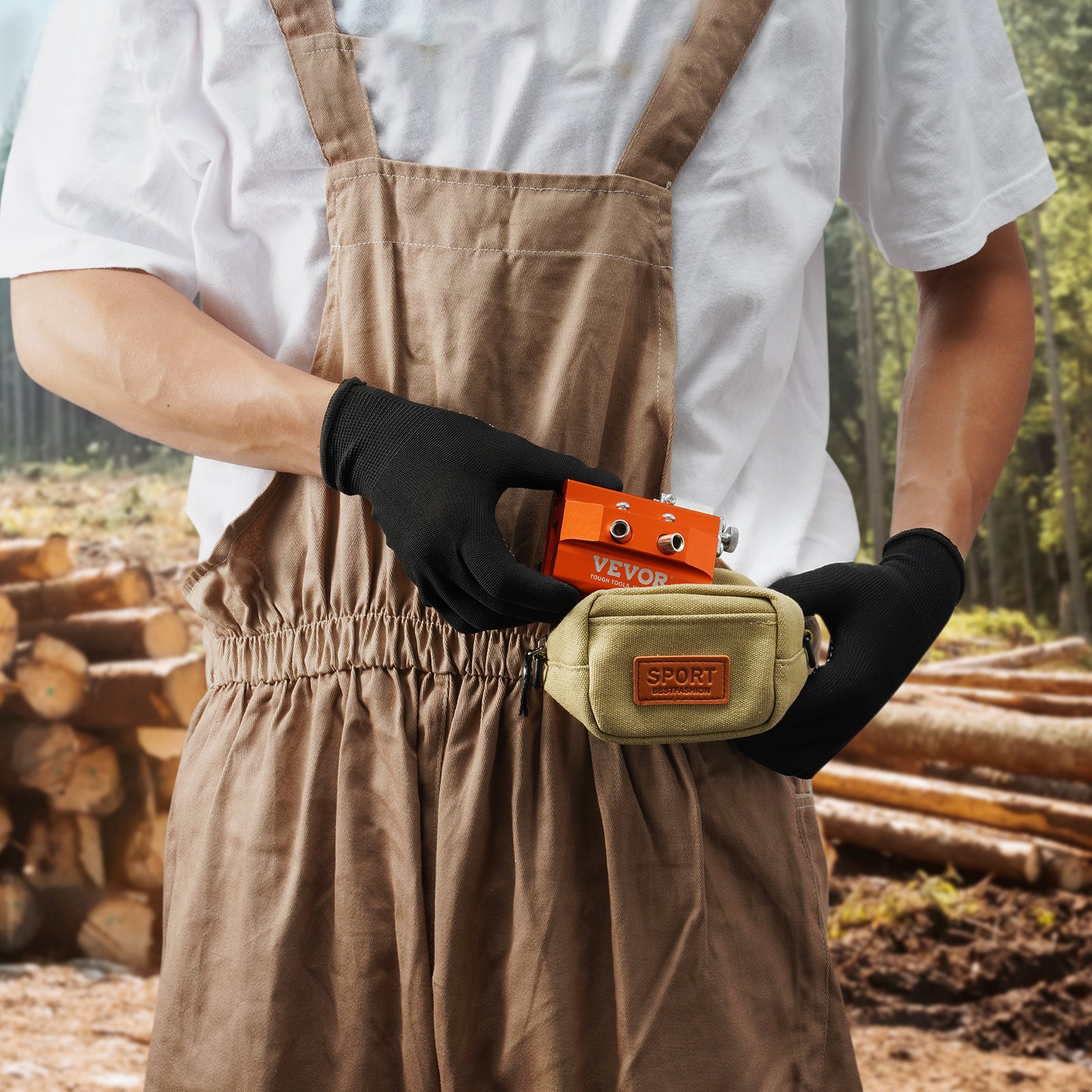 person in brown overalls holding VEVOR chainsaw sharpener in a forest with logs in the background.