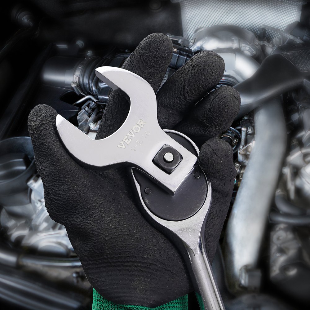 worker holding a VEVOR crowfoot wrench set in front of a car engine.