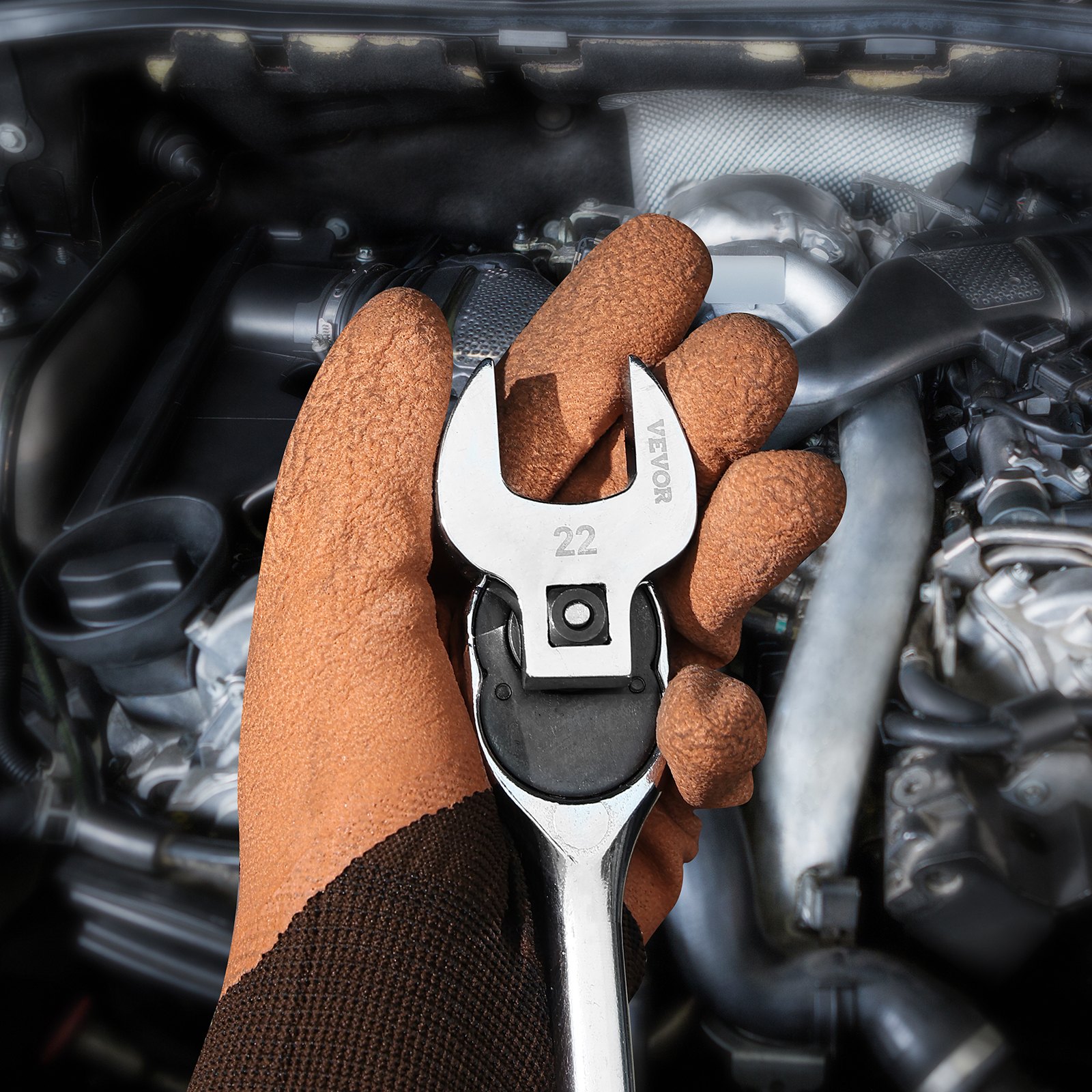 gloved hand holding a VEVOR crowfoot wrench set tool near an engine block.