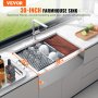 VEVOR 30-inch farmhouse sink with drying rack and cutting board on a white marble countertop.