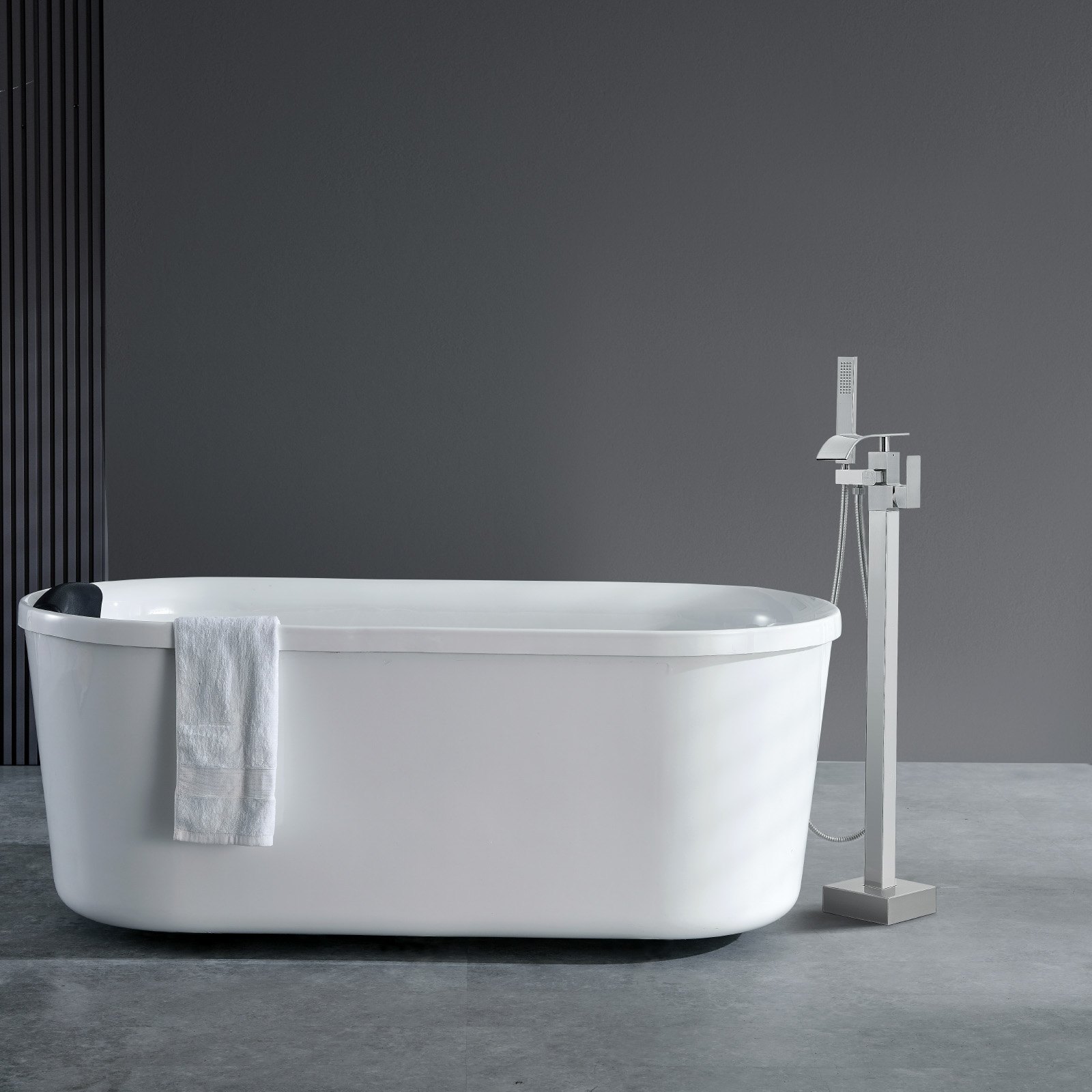 modern bathroom with VEVOR freestanding bathtub faucet and sleek white bathtub with towel hanging.