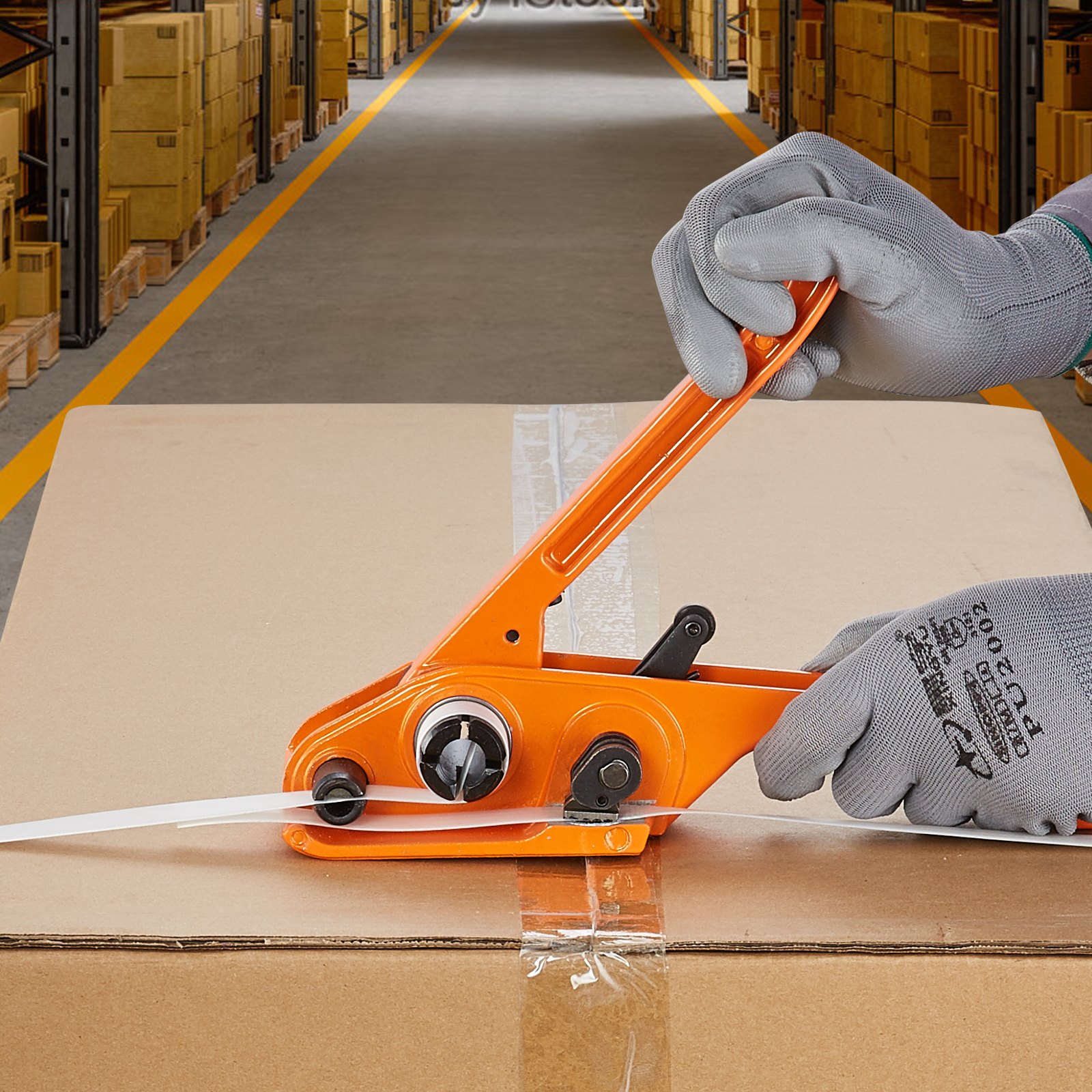 worker securing a box with VEVOR banding strapping kit in a warehouse.