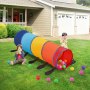 children playing with colorful VEVOR kids play tunnel on a lawn, surrounded by scattered plastic balls.