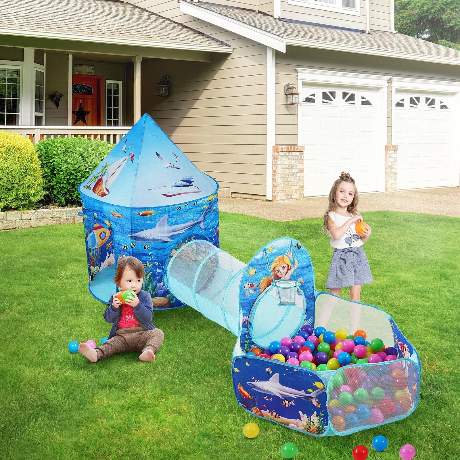 VEVOR kids play tent with play tunnel and ball pit on a lawn, surrounded by vibrant, colorful balls.
