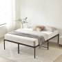 VEVOR queen metal bed frame with beige bedding, pillows, and a gray throw, in a bright, minimalist room.