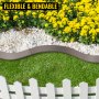 VEVOR steel lawn edging borders flowerbed with yellow flowers, white stones, and green grass.