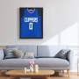 blue clippers jersey in a VEVOR jersey display frame above a light gray sofa and wooden coffee table.