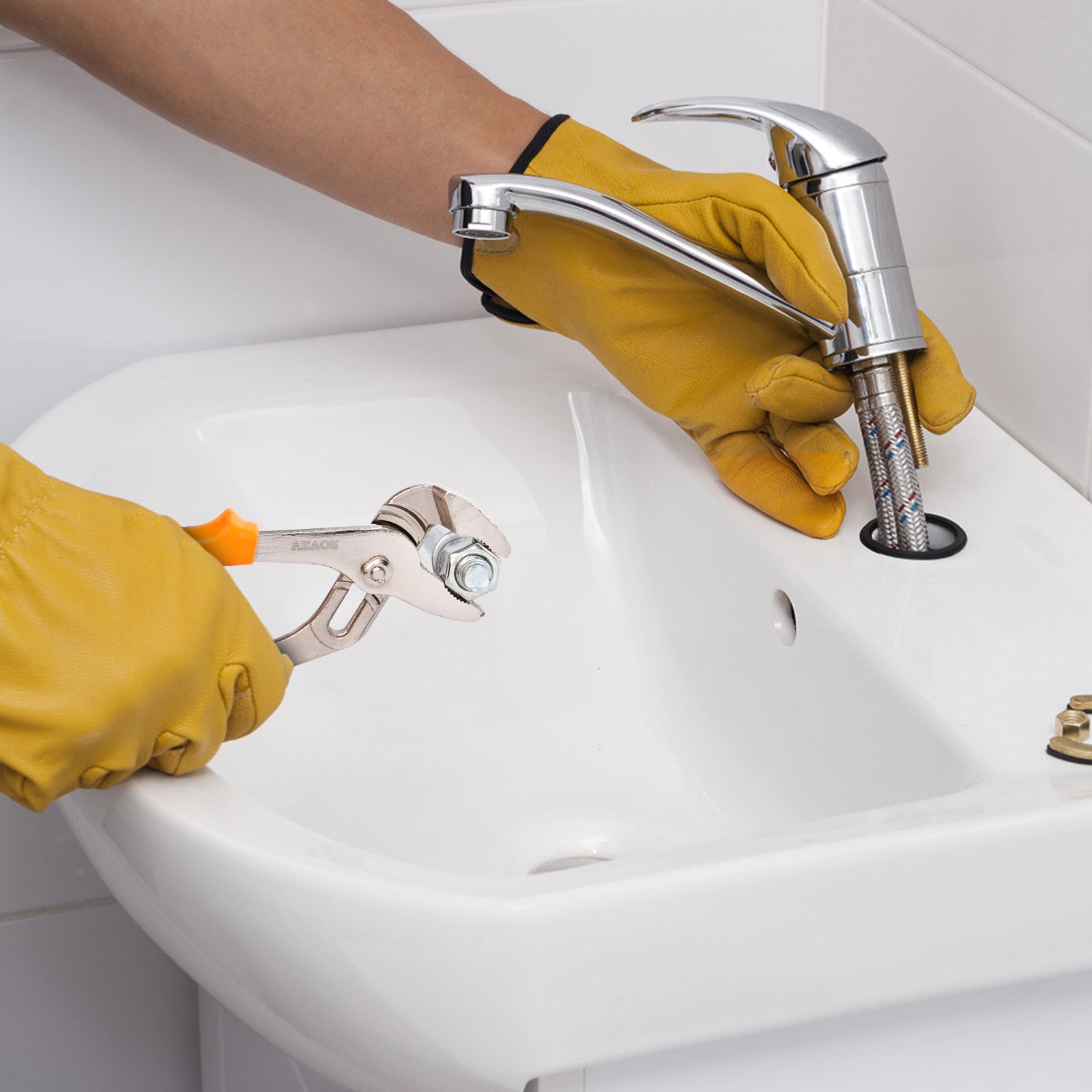 person using VEVOR groove joint pliers to fix a sink faucet, wearing yellow gloves.