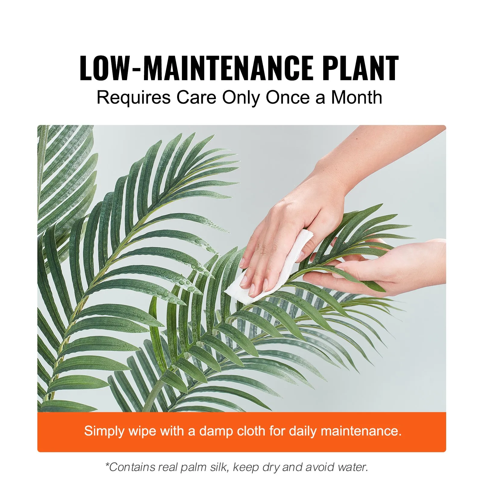 hands cleaning a VEVOR artificial palm tree leaf with a damp cloth, highlighting low maintenance care.