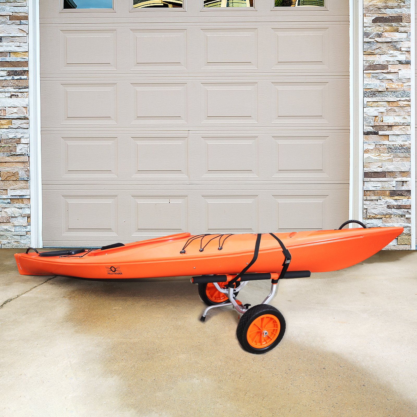 orange kayak on a VEVOR kayak cart in front of a beige garage door with stone trim.