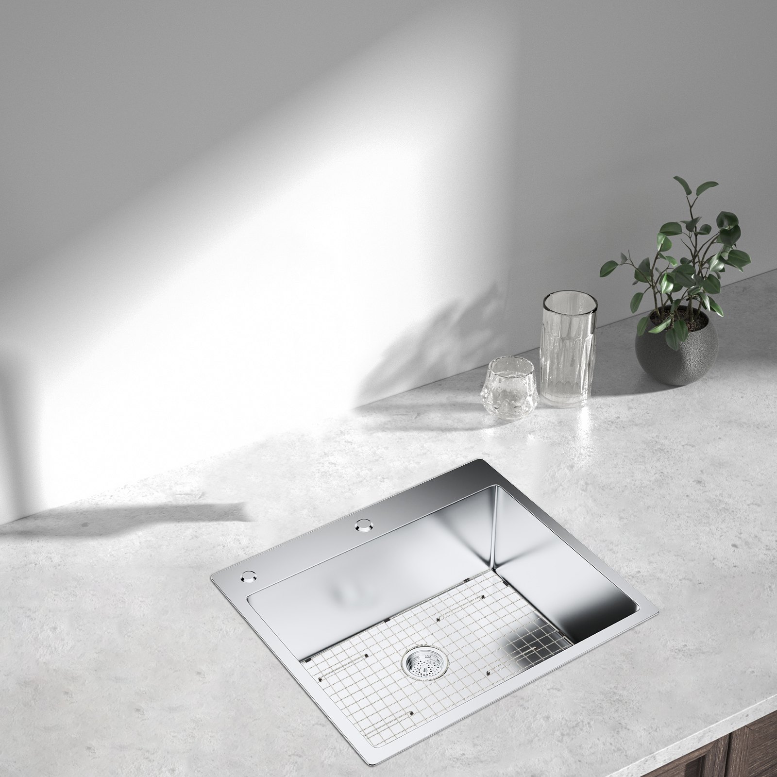 modern kitchen sink with VEVOR sink protector grid, glasses, and a small plant on the counter.