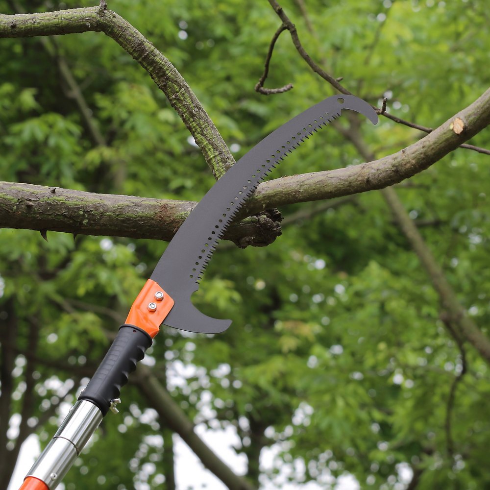 pole saw cutting tree branch in a lush green environment, VEVOR manual pole saw.