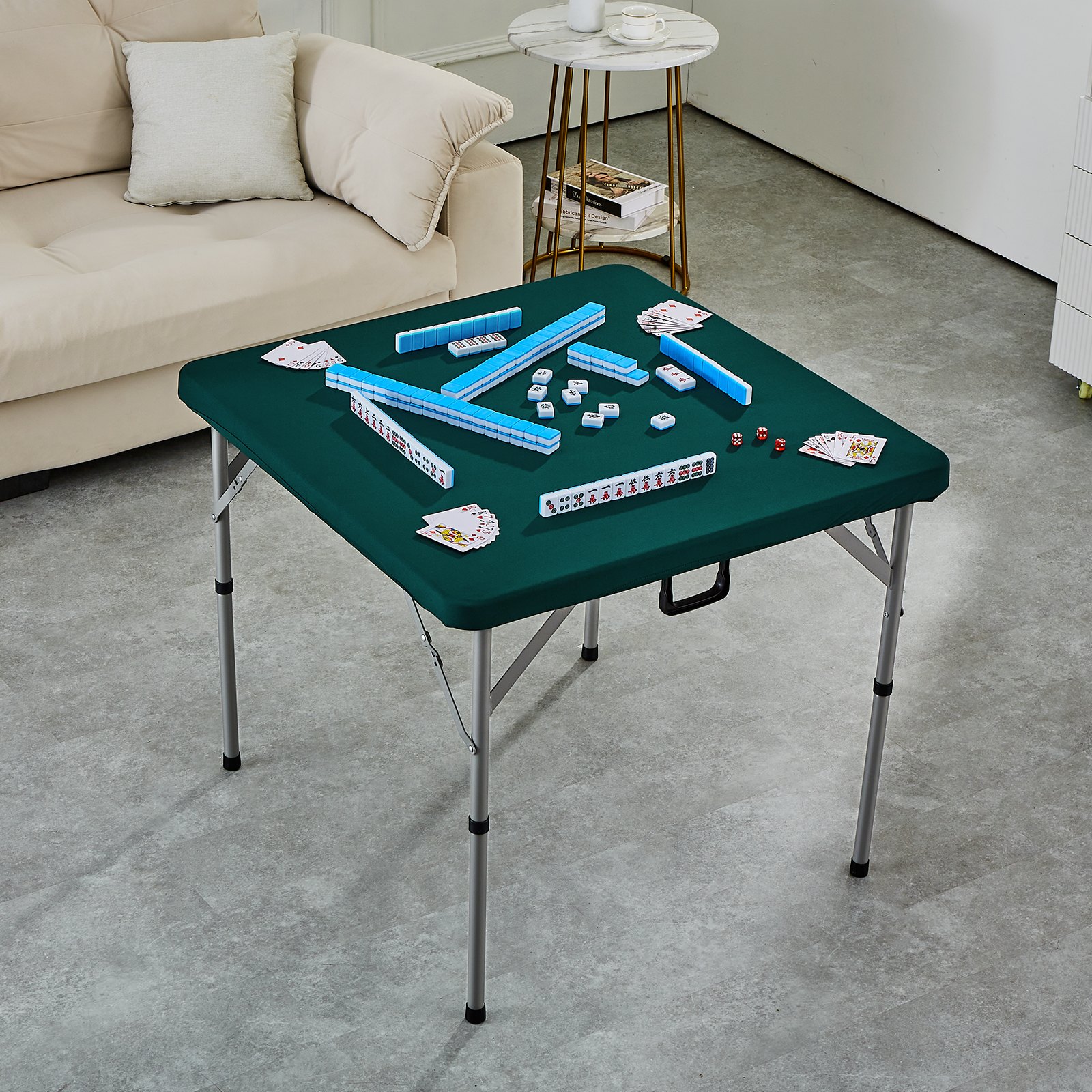 mahjong tiles and cards on a green VEVOR mahjong table in a cozy living room.
