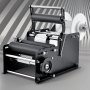 VEVOR manual round labeling machine with rollers and spindle on a striped gray background.