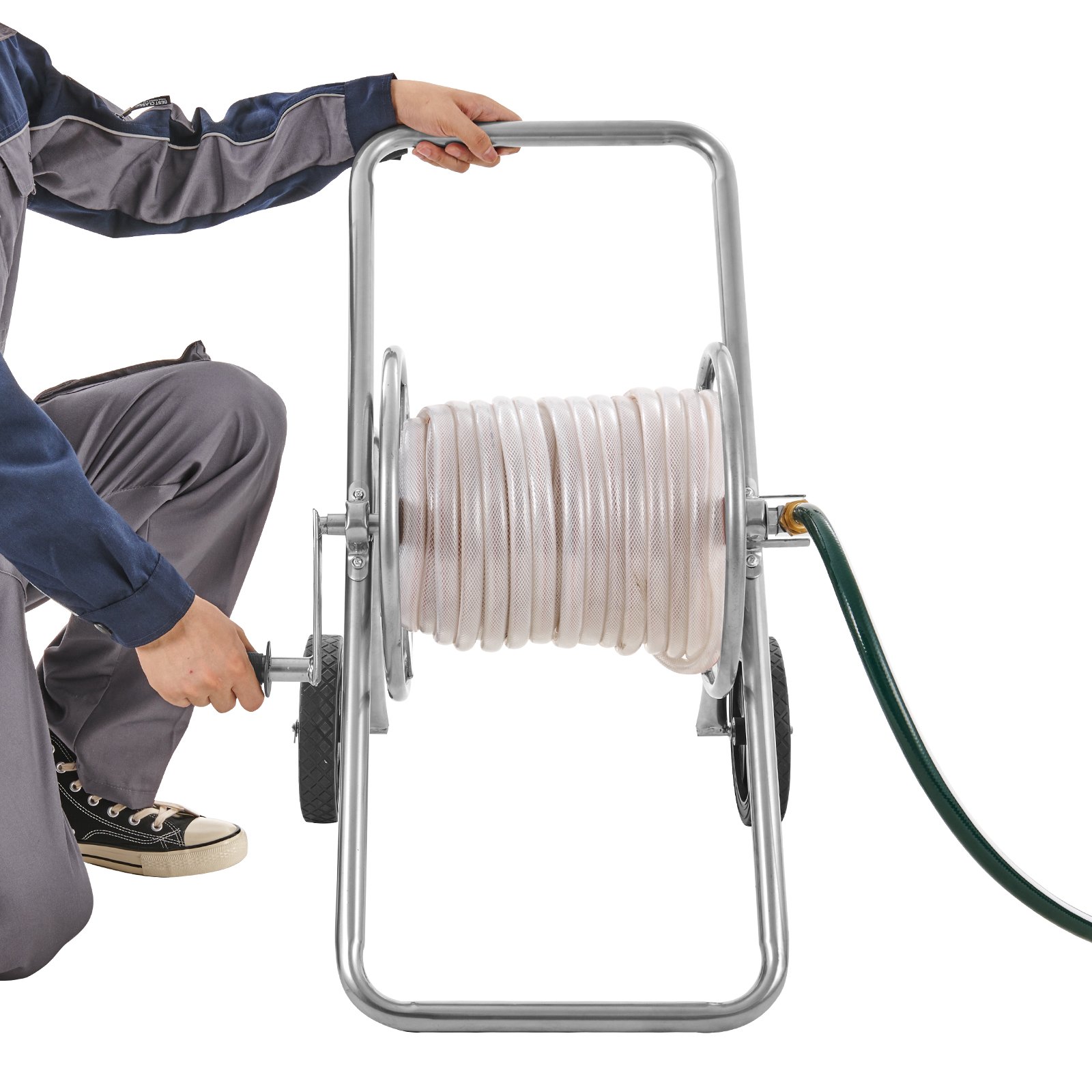 person using VEVOR hose reel cart with coiled hose and green hose attachment.