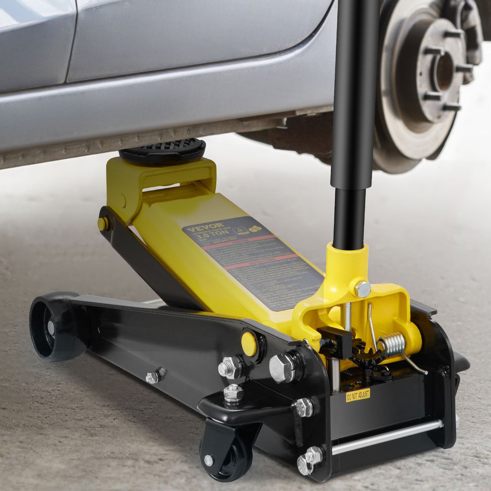 VEVOR 3 ton floor jack lifting a silver car, showcasing its sturdy build and efficient functionality.