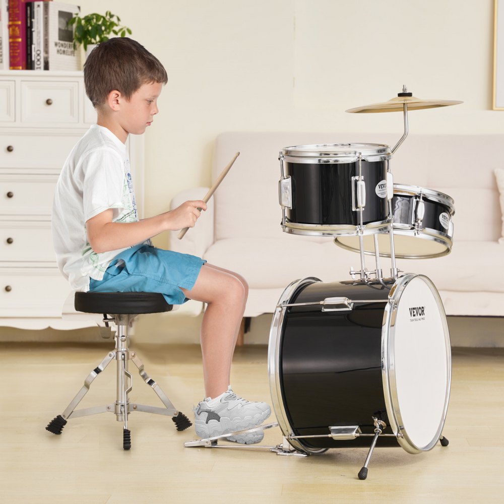 child playing VEVOR kids drum set in a cozy living room with white furniture and wooden floor.