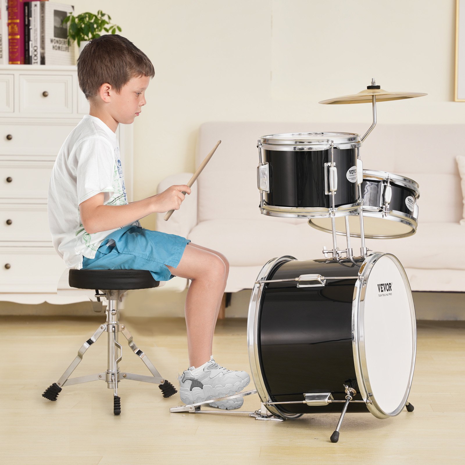 child playing VEVOR kids drum set in a cozy living room with white furniture and wooden floor.