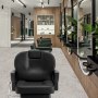 modern salon interior featuring a black VEVOR salon chair with wooden panels and mirrors in the background.