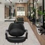 black VEVOR salon chair in modern salon with wooden accents, green chairs, and round mirrors.