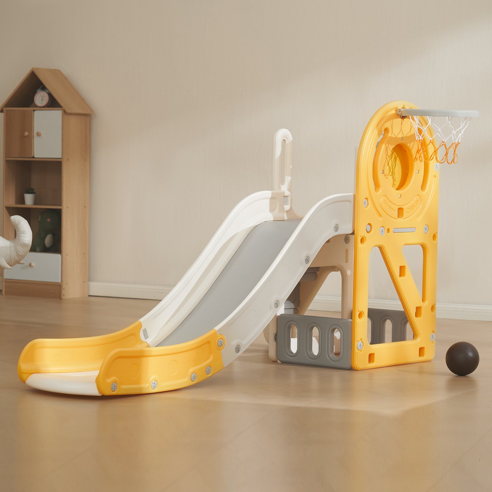 toddler play area with a yellow and white VEVOR toddler slide and basketball hoop in a cozy room.