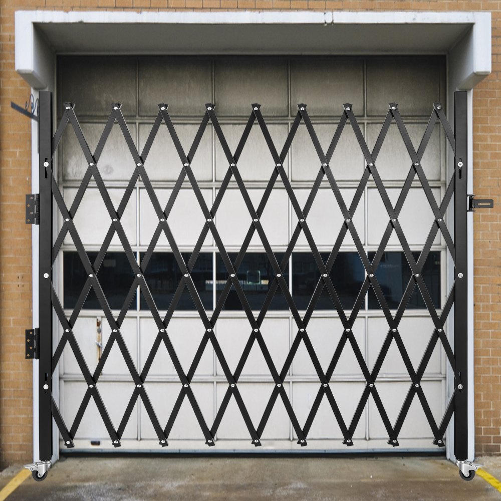 VEVOR folding security gate installed in a garage doorway, fully extended.