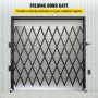 black VEVOR folding security gate creating a sturdy outdoor division against a corrugated wall.