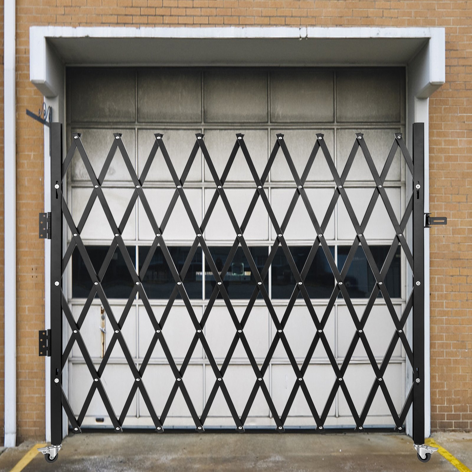VEVOR folding security gate in black grid design, securing a garage entrance.