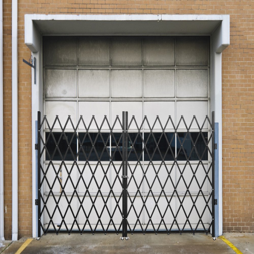 VEVOR folding security gate in front of a closed industrial garage door.