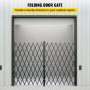 VEVOR folding security gate in a warehouse entrance with accordion-style metal design.