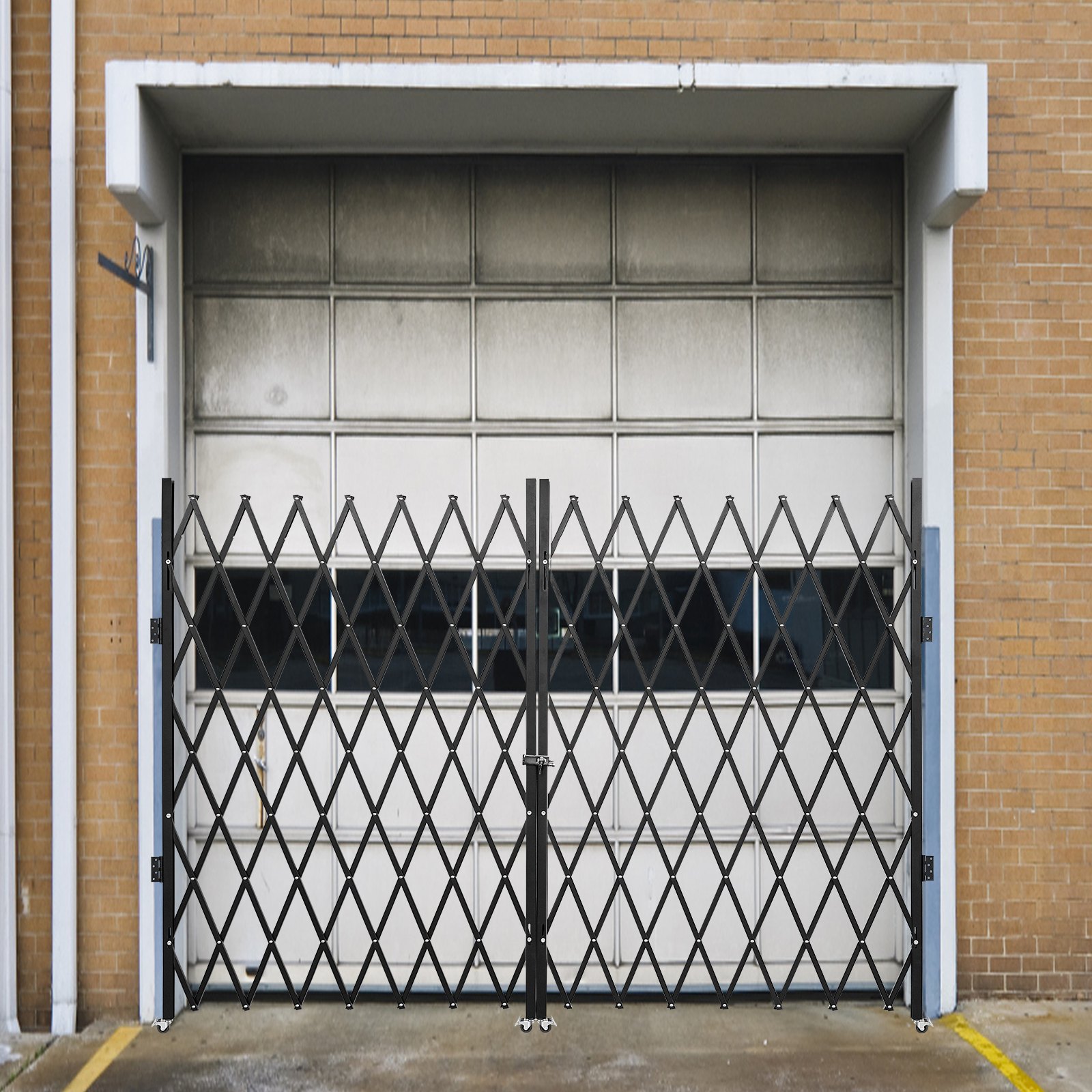 VEVOR folding security gate in front of a closed industrial garage door.