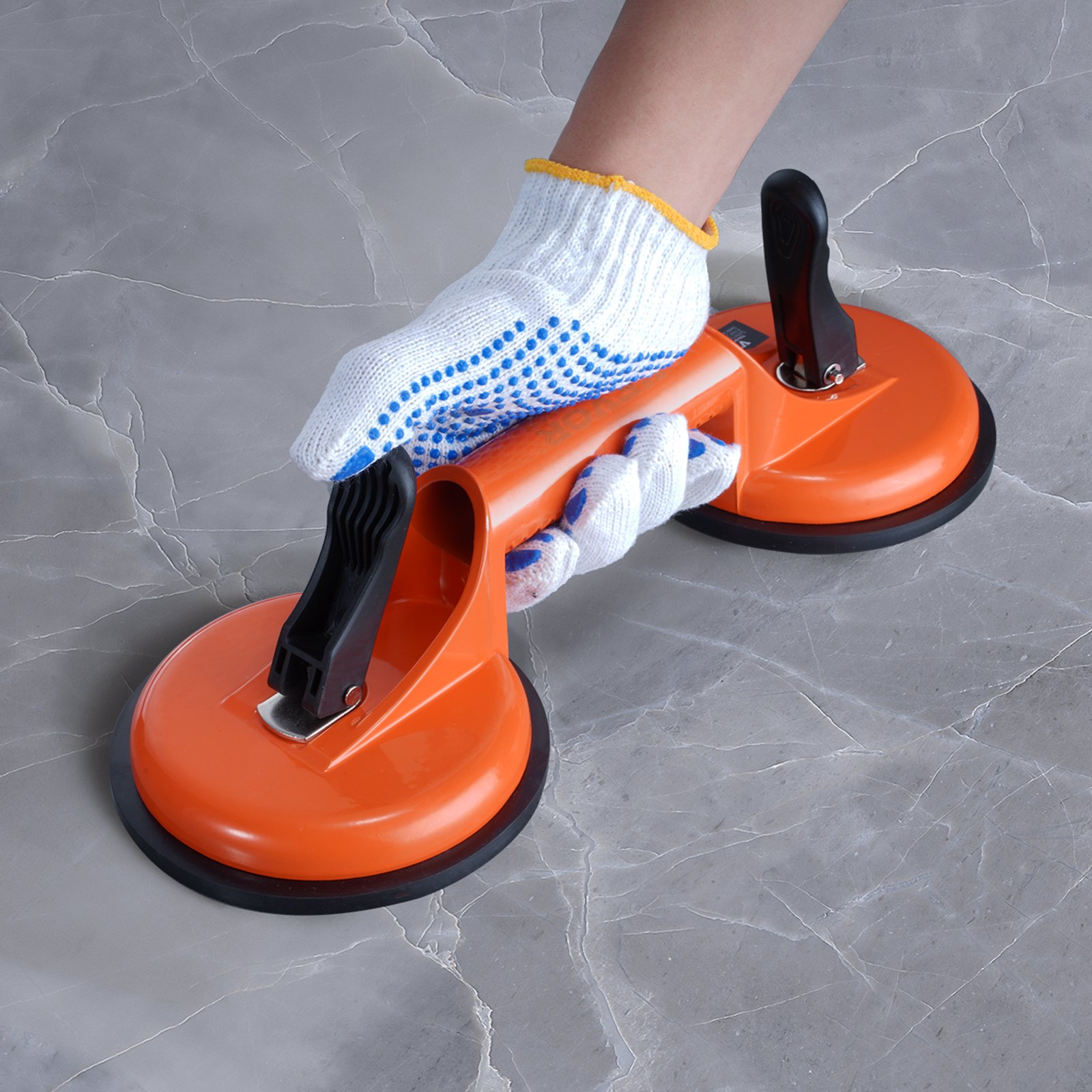VEVOR glass suction cup in use on a grey marble surface, held by a gloved hand.