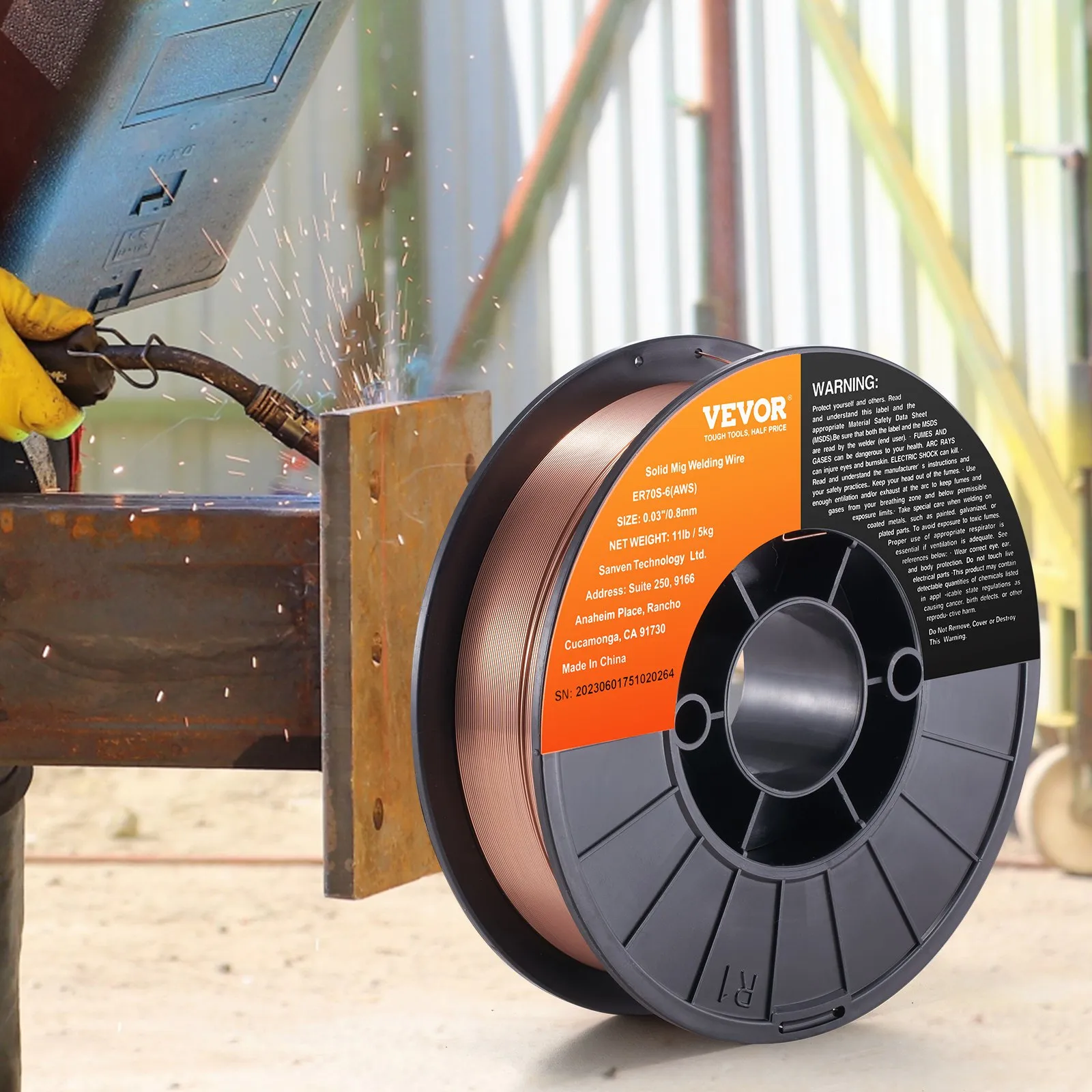 VEVOR mig welding wire spool next to a worker welding metal with sparks flying.