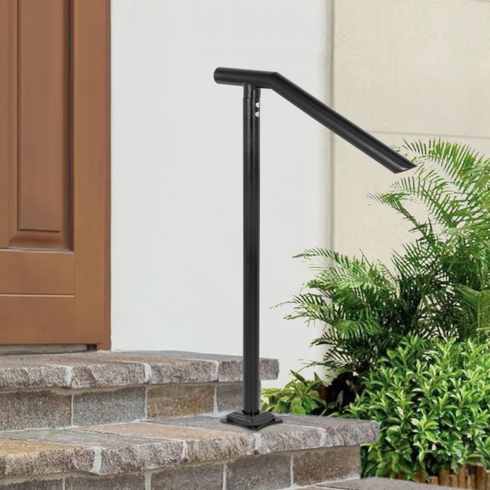 black VEVOR step railing on stone steps with greenery in the background.