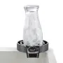 glass bottle being rinsed using VEVOR glass rinser on a kitchen sink.