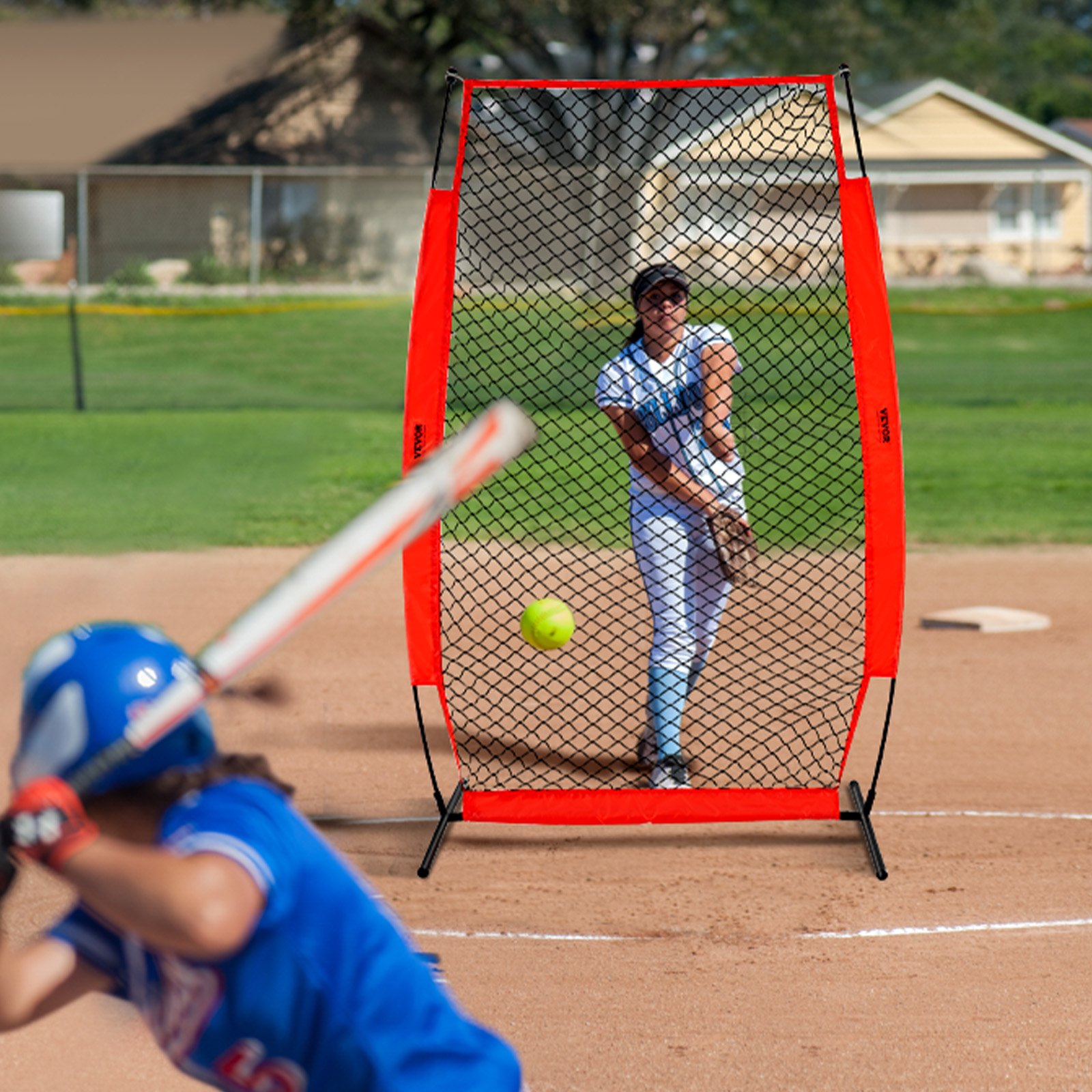 baseball player pitching with VEVOR batting cage screen in action, protecting the hitter on a sunny field.