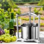 stainless steel VEVOR fruit wine press beside wine bottle, glass, and clusters of fresh grapes. vineyard background.