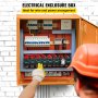 worker examines VEVOR electrical enclosure with wiring and circuit breakers against a white brick wall.